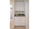 Charming hallway cabinet with white cabinetry and gold hardware, perfect for storage and decor at 1501 Willshire Dr, Greenwood, IN 46143