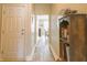 Long hallway leads to dining room with a view of a small library area at 1501 Willshire Dr, Greenwood, IN 46143
