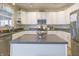 Bright kitchen features white cabinetry, stainless appliances, and a functional center island at 1501 Willshire Dr, Greenwood, IN 46143