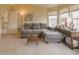 Comfortable living room with large windows, neutral colors, and a cozy sectional sofa at 1501 Willshire Dr, Greenwood, IN 46143