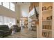 Open concept living room with high ceilings, large windows, hardwood floors and modern decor at 1501 Willshire Dr, Greenwood, IN 46143