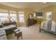 Spacious main bedroom features large windows, ensuite bath, a neutral color palette, and comfortable bedding at 1501 Willshire Dr, Greenwood, IN 46143