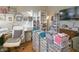 Well-organized office area with craft supplies, rolling carts, shelving, a desk, and an office chair at 1501 Willshire Dr, Greenwood, IN 46143