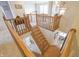 Elegant staircase with wooden banister and railing leads to the lower level dining area at 1501 Willshire Dr, Greenwood, IN 46143