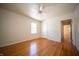 Bedroom featuring wood floors, white walls and natural light from a window at 1701 Broad Ripple Ave, Indianapolis, IN 46220