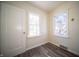 Bedroom with neutral walls, new flooring and natural light from two windows at 1701 Broad Ripple Ave, Indianapolis, IN 46220