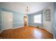 Dining room featuring hardwood floors and a decorative built-in cabinet at 1701 Broad Ripple Ave, Indianapolis, IN 46220
