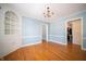 Dining room featuring hardwood floors, a chandelier, and built in cabinets at 1701 Broad Ripple Ave, Indianapolis, IN 46220