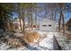 View of the property's detached one car garage with snow in the winter season at 1701 Broad Ripple Ave, Indianapolis, IN 46220