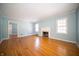 Bright living room with hardwood floors, fireplace, and ample natural light at 1701 Broad Ripple Ave, Indianapolis, IN 46220