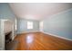 Light-filled living room with hardwood floors and decorative fireplace at 1701 Broad Ripple Ave, Indianapolis, IN 46220