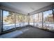 Spacious screened-in porch providing an outdoor living space with a view at 1701 Broad Ripple Ave, Indianapolis, IN 46220