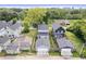 Aerial view of neighborhood highlighting multiple homes, mature trees, and surrounding landscape at 1842 Milburn St, Indianapolis, IN 46202