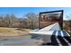 View of an iron pedestrian bridge framed by natural scenery and a walking path at 1842 Milburn St, Indianapolis, IN 46202
