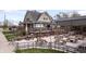Charming exterior view of a restaurant with outdoor patio seating and picnic tables at 1842 Milburn St, Indianapolis, IN 46202