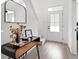 Bright foyer showcasing a sleek console table with decorative elements and a view of the staircase at 1842 Milburn St, Indianapolis, IN 46202