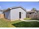 Detached garage with siding and a well-maintained lawn at 1842 Milburn St, Indianapolis, IN 46202