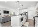 Bright open kitchen with a central island, stainless steel appliances, and seamless flow to the living area at 1842 Milburn St, Indianapolis, IN 46202