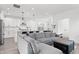 Bright, open living space with a comfortable sectional sofa connected to a kitchen with modern features at 1842 Milburn St, Indianapolis, IN 46202