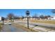 A well-maintained street view with a clear blue sky overhead at 1842 Milburn St, Indianapolis, IN 46202