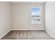 Bright bedroom with gray carpet and window with outdoor neighborhood views at 20238 Allegheny Ln, Westfield, IN 46074