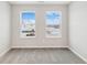 Empty bedroom with neutral carpet and two windows providing natural light at 20238 Allegheny Ln, Westfield, IN 46074