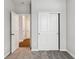 Neutral bedroom with gray walls, carpet and closet with white sliding doors at 20238 Allegheny Ln, Westfield, IN 46074
