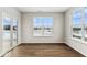 Inviting dining room featuring wood floors, abundant natural light, and a sliding glass door to the outdoors at 20238 Allegheny Ln, Westfield, IN 46074