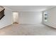 Large living room with plush carpet, neutral walls, and staircase view, offering a comfortable and inviting space at 20238 Allegheny Ln, Westfield, IN 46074