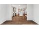 Bright, open living space featuring hardwood floors, neutral paint, and a view of the modern kitchen at 20238 Allegheny Ln, Westfield, IN 46074