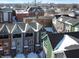 Aerial view of new townhomes displays modern design amidst a developing urban landscape at 2115 Coretta Way, Indianapolis, IN 46202