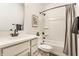 Bright bathroom features a shower-tub combo, modern fixtures, and stylish design at 2115 Coretta Way, Indianapolis, IN 46202