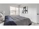 Comfortable bedroom with a black and white theme, a plush bed, and a minimalist modern aesthetic at 2115 Coretta Way, Indianapolis, IN 46202