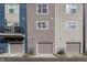 Up-close view of new townhome exteriors shows modern design with private balconies and attached garages at 2115 Coretta Way, Indianapolis, IN 46202