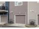 Attached garages provide convenience and security for these modern townhomes, shown in detail at 2115 Coretta Way, Indianapolis, IN 46202
