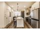 Modern kitchen design featuring gray lower cabinets, white upper cabinets, and a functional center island at 2115 Coretta Way, Indianapolis, IN 46202