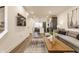 Bright living room showcases open floor plan, modern decor, and seamless transition to the kitchen at 2115 Coretta Way, Indianapolis, IN 46202