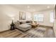Cozy living room featuring a comfortable gray sofa, modern art, and ample natural light at 2115 Coretta Way, Indianapolis, IN 46202