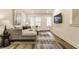 Bright living room featuring modern decor, neutral tones, and a stylish area rug over hardwood floors at 2115 Coretta Way, Indianapolis, IN 46202
