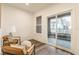 Inviting sitting room with balcony access features neutral decor and sleek flooring at 2115 Coretta Way, Indianapolis, IN 46202