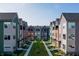 Scenic aerial view of colorful townhomes showcasing landscaping and community green space at 2139 Coretta Way, Indianapolis, IN 46202