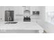 Well-lit kitchen featuring stainless appliances, white cabinetry, and expansive countertop space at 2139 Coretta Way, Indianapolis, IN 46202