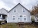 Charming two-story home featuring a classic design and gray siding at 321 N Elder N Ave, Indianapolis, IN 46222
