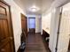 Well-lit hallway with hardwood floors and ample closet space at 321 N Elder N Ave, Indianapolis, IN 46222