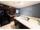 Modern kitchen with stainless steel appliances and an island featuring a countertop range at 321 N Elder N Ave, Indianapolis, IN 46222