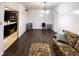 Spacious living room with modern floors, abundant light, and a view into the kitchen area at 321 N Elder N Ave, Indianapolis, IN 46222