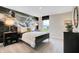 Stylized bedroom with industrial-chic decor and an accent wall mural at 4406 Mendocino Blvd, Indianapolis, IN 46075