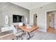 Bright home office features a wood-look accent wall, built-in storage, and access to other areas of the home at 4406 Mendocino Blvd, Indianapolis, IN 46075