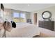 Spacious bedroom with a king bed, dresser, and sunny windows at 4406 Mendocino Blvd, Indianapolis, IN 46075