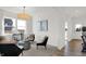 Bright living room with plush seating, decorative wall art, and an exterior view at 4424 Mendocino Blvd, Indianapolis, IN 46239